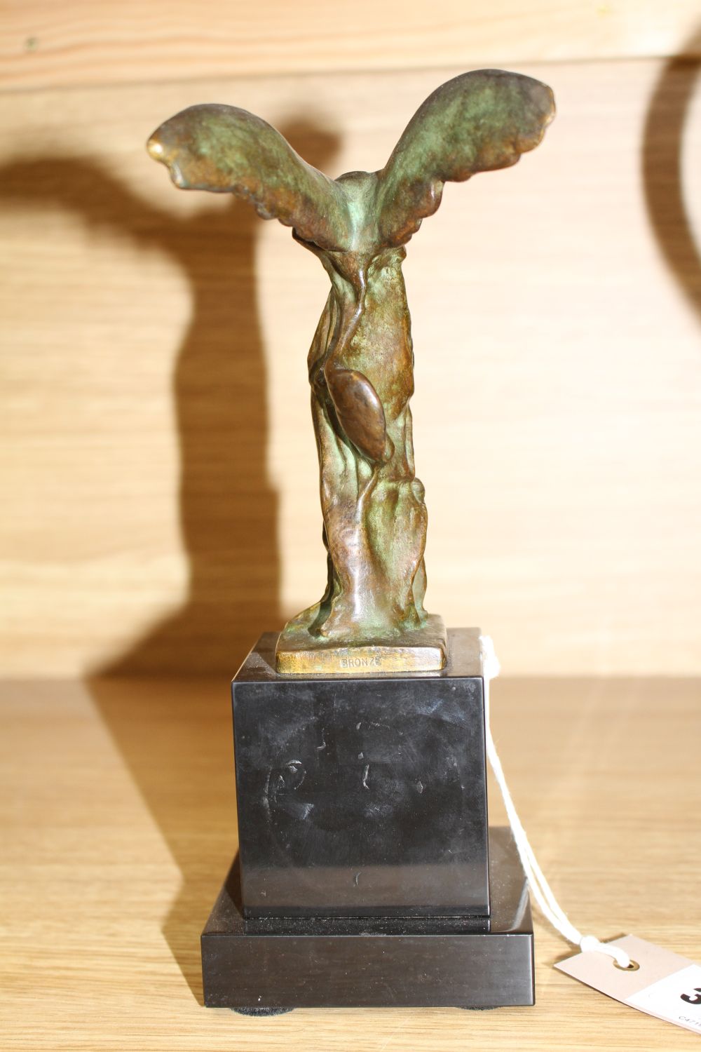 Max Le Verrier (1891-1973). A bronze group La Victoire de Samothrace, on black marble plinth, overall height 23.5cm